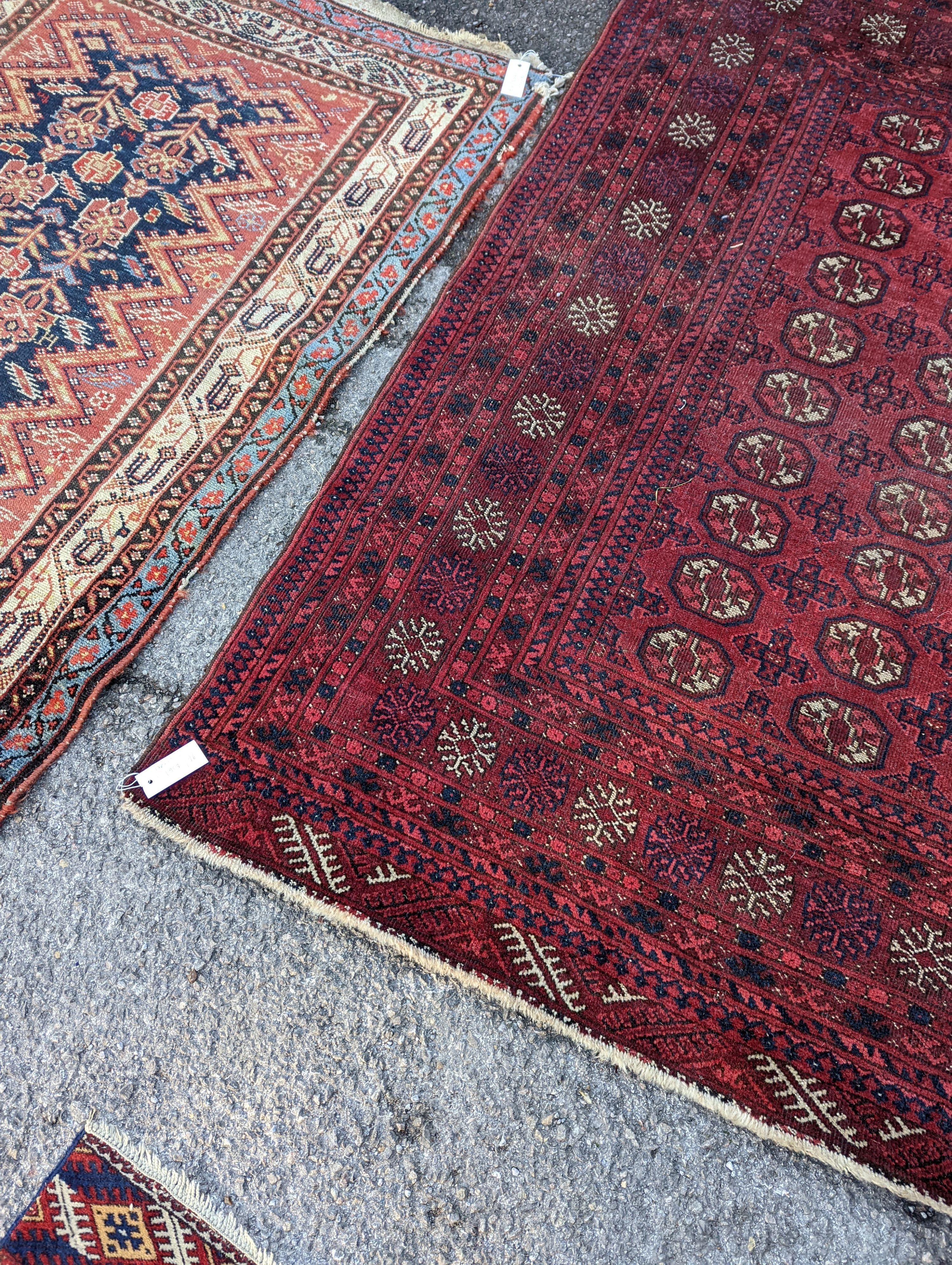 A Bokhara red ground rug, 176 x 135cm